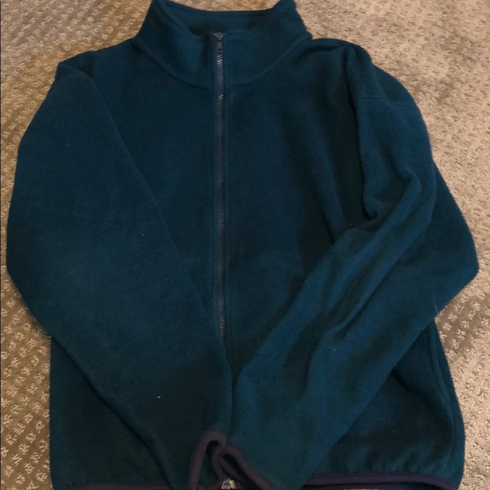Teal colored windbreaker